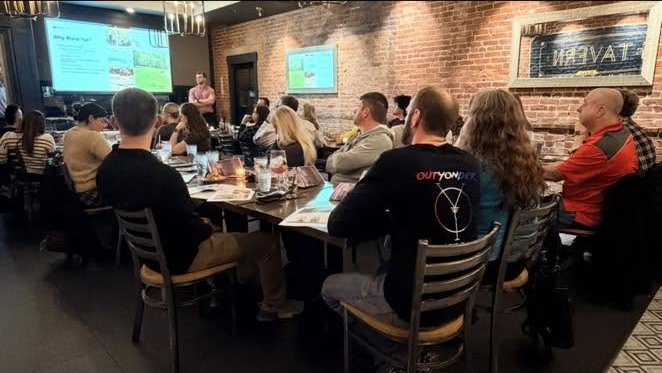 A full room at an Isaac Construction presentation